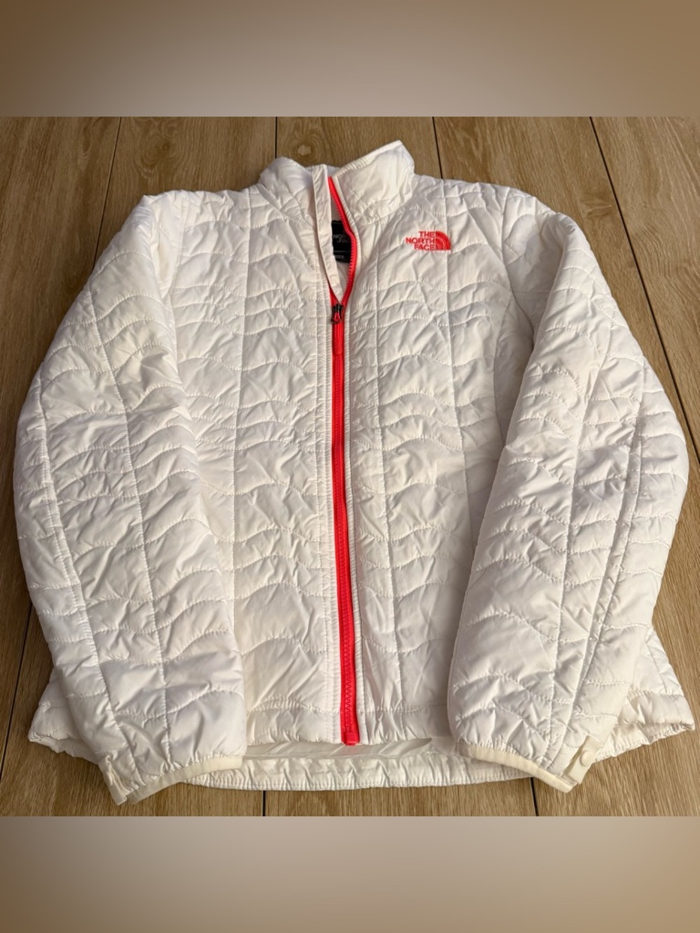 The North Face White Quilted Puffer Jacket with Orange Zipper